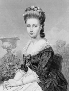 A black and white print of a seated white woman, Sarah Livingston Jay. She is wearing a dress with ruffles and bows. Her hair is decorated with flowers and in an updo. The background is naturalistic.