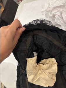 interior of bodice, can see where the structure was changed by the sleeve