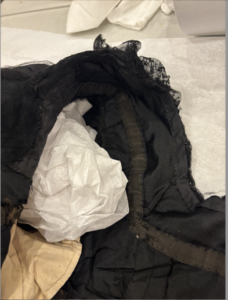 interior of bodice, can see where the structure was changed by the sleeve